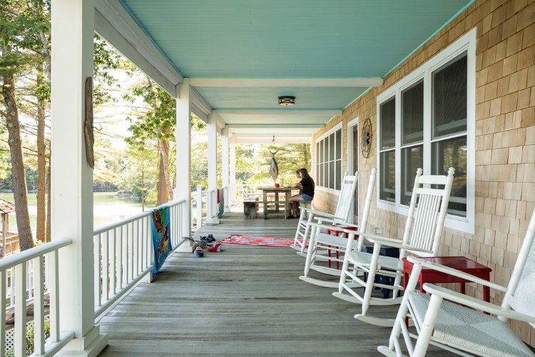 Front porch with rocking chairs on a home built by Oceanside Builders